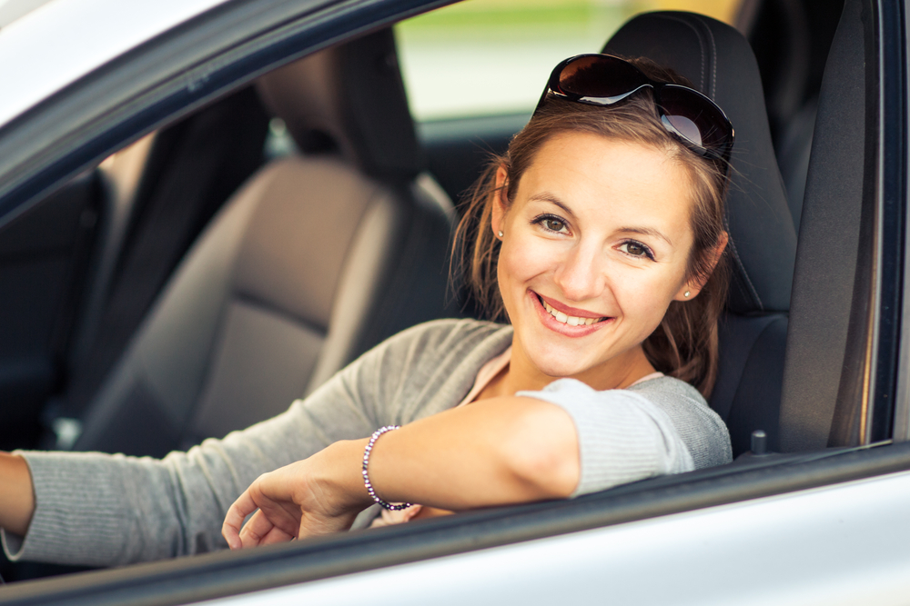young woman driving car